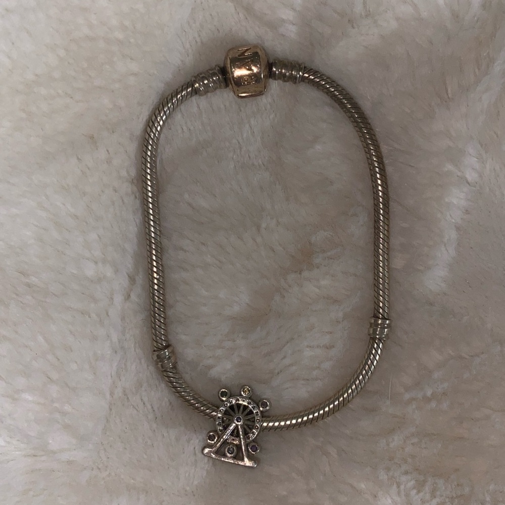 PANDORA rose gold bead charm bracelet with ferris wheel charm.